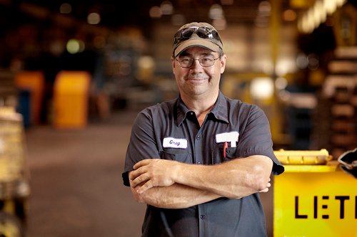 Portrait of Smiling Steel Worker in Factory